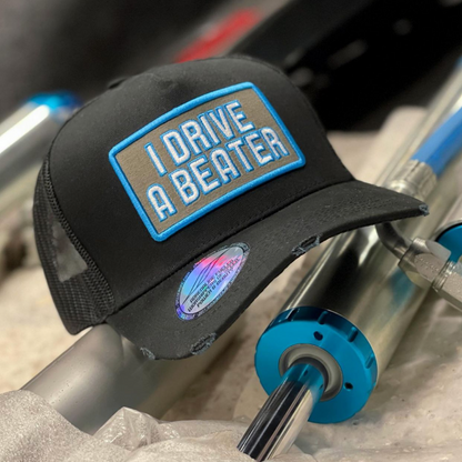 "I Drive a Beater" Trucker Hat (Black - Distressed)